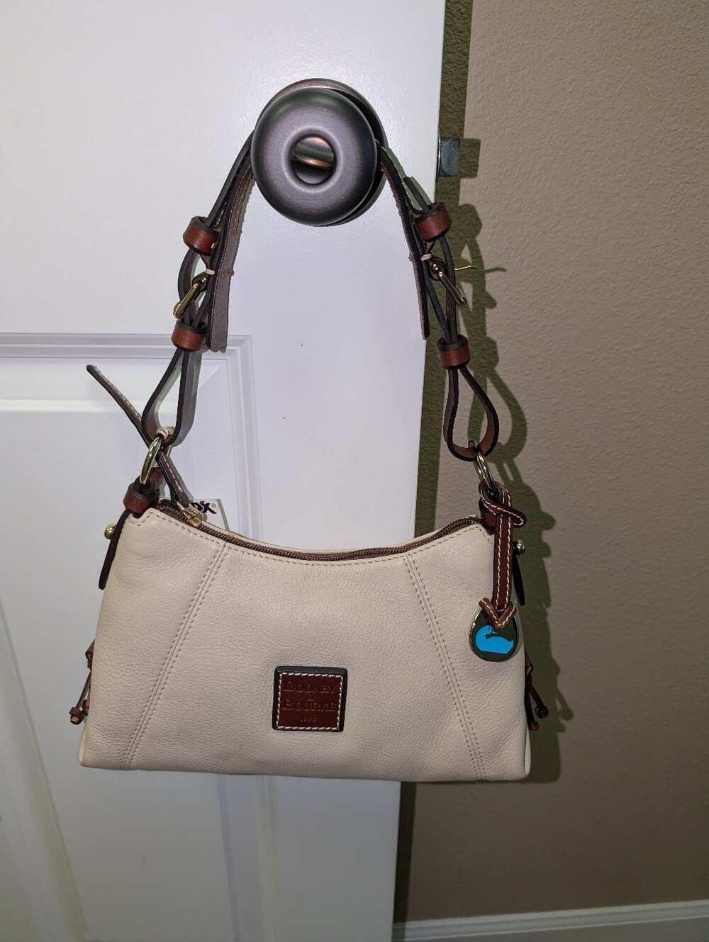 Dooney & Bourke cream and brown leather purse